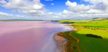 Insane drone photos of pink lakes, erupting volcanoes, and more